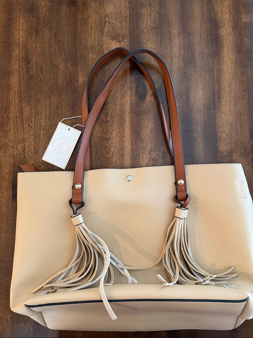 Cream Tote Bag with Brown Shoulder Straps and Tassel Accents